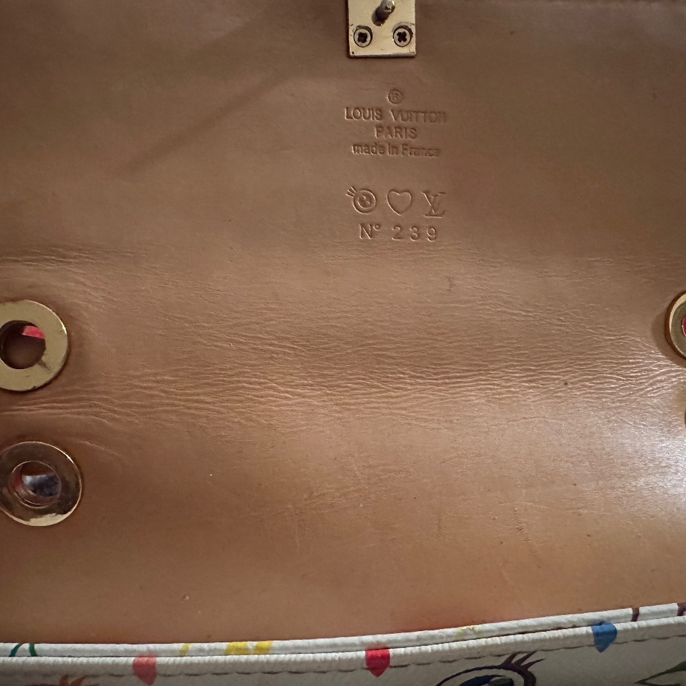 This is a Louis Vuitton x Takashi Murakami "Eye Need You" bag